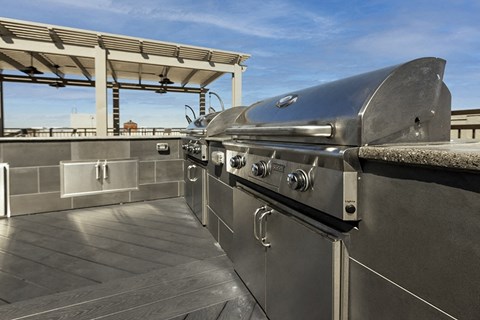 Rooftop BBQ area with seating